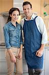 Couple standing together in the kitchen