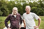 Father and son looking at camera, portrait