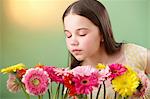 Girl sniffing flowers