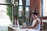 Businesswoman at desk using laptop