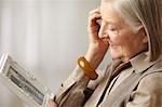 Senior woman holding picture frame