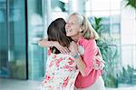 Adult mother and daughter embracing