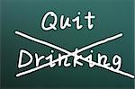 Quit drinking written on a blackboard background with a cross