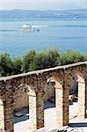 View of Garda Lake and Roman ruins known as "Catullo Caves" in Sirmione, Italy