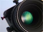 Professional camera lens close-up on a white background