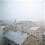 Heavy snowfall in the city at the beginning of winter