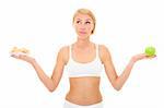 A picture of a young fit woman deciding between eating an apple or cookies over white background