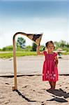 girl toddler is having fun in the playground