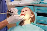 Young bloonde girl in dentist office chair