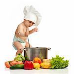 Little boy in chef's hat with ladle, pot, and vegetables on white background