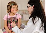 Doctor examining child at office