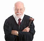 Wise, kind looking judge holding his gavel.  Isolated on white background.