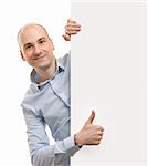 cheerful business man with blank banner showing thumbs up gesture
