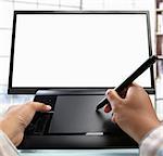 designer's hand Working with digital tablet  pen, with blank monitor screen. PS: a bit addition to the height by stiching another photo because the original one was in tight crop composition