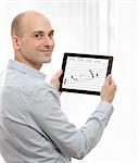 business man using a touch screen device with Stock Quotes