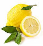 Fresh lemon with leaves over white.