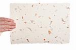 Handmade paper in woman hand isolated on white background