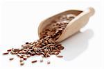 Flax seeds on a wooden scoop