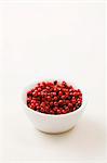 A bowl of pink peppercorns