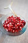 Pomegranate Seeds in a Small Bowl with Spoon