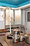 Cooking pots on a stove in a large kitchen