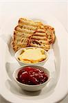 Strawberry jam, butter and toasted ciabatta