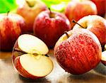 Freshly washed red apples, whole and halved