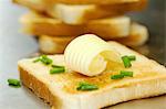 Toast with a curl of butter and chives