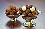 Assorted chocolates in silver dishes