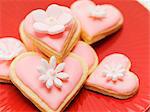 Pink heart-shaped biscuits with sugar flowers