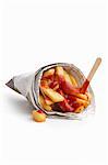 Chips with ketchup wrapped in newspaper