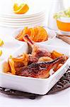 Roast duck leg with oranges