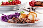 Roast goose breast with dumplings, red cabbage and gravy