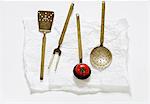 Various old kitchen utensils and a tomato