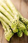 Green asparagus on wooden background