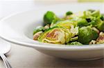 Serving Bowl of Sauteed Brussels Sprouts with Macadamia Nuts