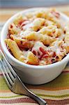 Individual Baked Penne with Tomatoes and Cheese; Fork