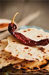 Dried Chili Pepper on a Stack of Crispy Tortillas