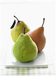 Three Assorted Pears in a Row on Rectangular Dish