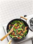 Chicken and mange tout in a wok