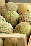 Galia melons in a wooden crate