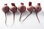 A row of five beetroots