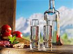 Two glasses of schnapps for supper against a alpine backdrop