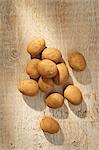 Potatoes on a wooden surface (seen from above)