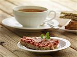 Bread spread with Teewurst and a cup of tea