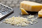 Grana Padano (hard Italian cheese) grated and whole