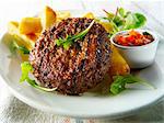 Grilled hamburgers with fries and salad