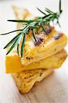 Grilled polenta slices with rosemary