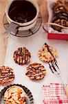 Florentines being decorated with chocolate icing