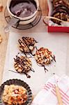 Florentines being decorated with chocolate icing